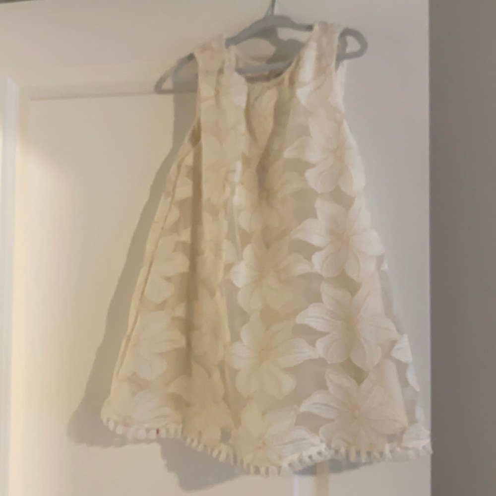 Cute cream colored lacey dress.